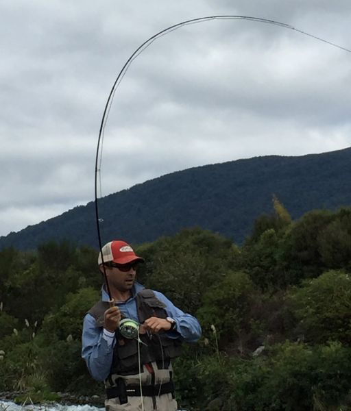 Sean applying maximum pressure but despite chasing it downriver this brown got away. We can't show you the bottom half of the photo ... there's a rod sticking out of it.