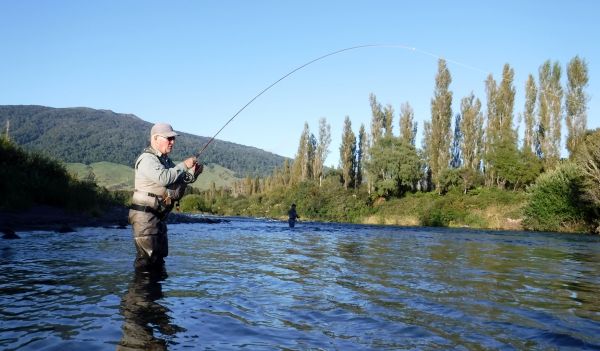 Mike into a good fish while Peter keeps his distance.